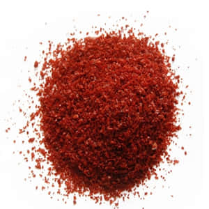 Vibrant Red Chili Powder Displayed On A Wooden Spoon Wallpaper