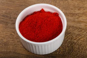 Vibrant Red Chili Powder In A Bowl Wallpaper