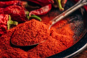 Vibrant Red Chili Powder In A Bowl Wallpaper