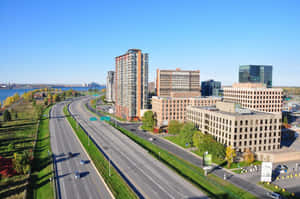 Vibrant Skyline Of Longueuil At Sunset Wallpaper