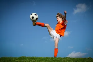 Vibrant Thrill Of Children's Soccer Wallpaper