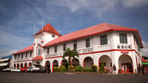 Vibrant View Of The Chan Mow Supermarket Complex In Apia Wallpaper