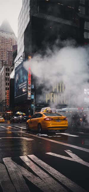 Vibrant Yellow Cab In The City Wallpaper