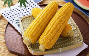 Vibrant Yellow Corn On A Rustic Wooden Table Wallpaper