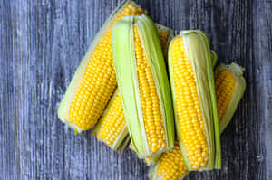 Vibrant Yellow Corn On The Cob Wallpaper