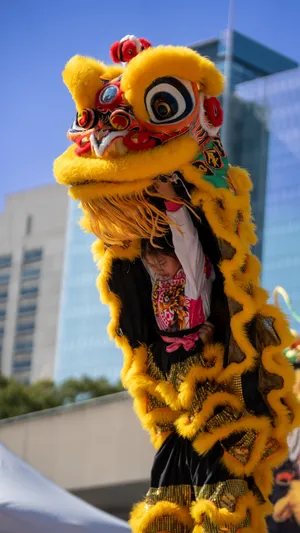 Vibrant Yellow Lion Dance Wallpaper