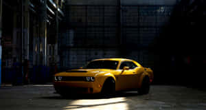 Vibrant Yellow Sports Car On The Open Road Wallpaper