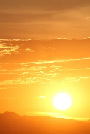 Vibrant Yellow Sunset Over Stunning Landscape Wallpaper