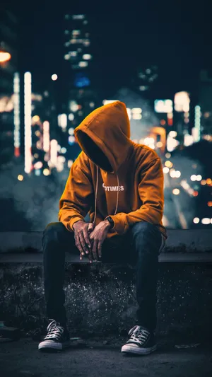 Vibrant Yet Melancholic - Cool Sad Boy In Yellow Hoodie Wallpaper