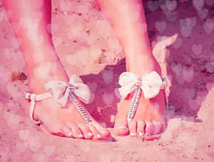 Vibrantly Colored Beach Sandals On Sun-soaked Sand Wallpaper