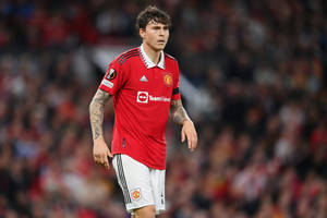 Victor Lindelof In Action On Football Field Wallpaper