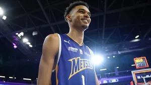 Victor Wembanyama In Action On The Basketball Court Wallpaper