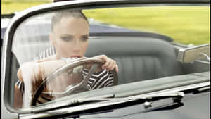 Victoria Beckham Driving Classic Car Wallpaper