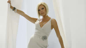 Victoria Beckham Elegant White Dress Wallpaper