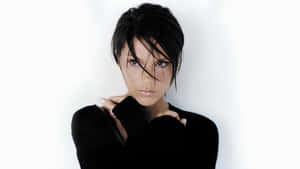 Victoria Beckham Iconic Fashion Portrait Wallpaper
