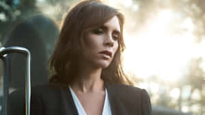 Victoria Beckham Stylish Outdoor Portrait Wallpaper