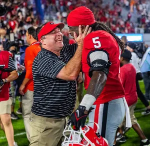 Victorious Embrace Football Game Wallpaper