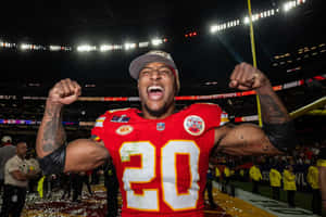 Victorious Football Player Celebration Wallpaper