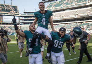 Victorious Football Player Celebration Wallpaper