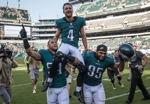 Victorious Football Player Celebration Wallpaper