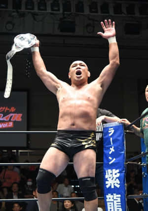 Victorious M M A Fighter Raising Belt Wallpaper