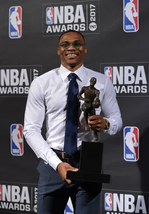 Victorious Nba Player Holding His Award With Pride Wallpaper