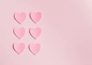 View Of A Majestic Lake Surrounded By Lush Green Vegetation. Wallpaper