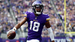 Vikings Player Catching Football Wallpaper