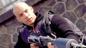 Vin Diesel With Rifle Wallpaper