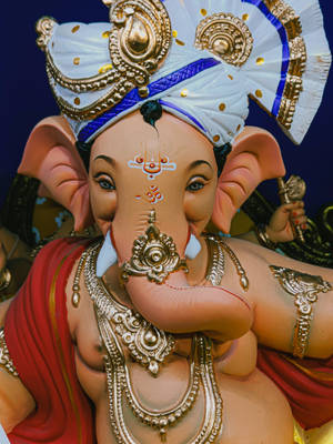 Vinayaka With White And Blue Headwear Wallpaper