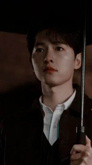 Vincenzo Holding An Umbrella Wallpaper