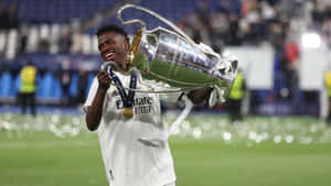 Vini_ Jr_ Champions_ League_ Trophy_ Celebration Wallpaper