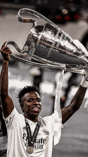 Vini_ Jr_ Champions_ League_ Trophy_ Celebration Wallpaper