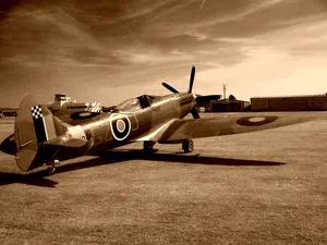 Vintage Airplane Soaring In The Blue Sky Wallpaper