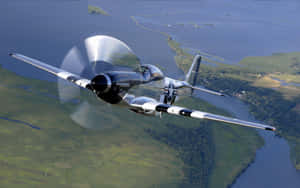 Vintage Airplane Soaring Through The Clouds Wallpaper