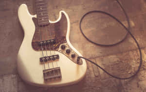 Vintage Bass Guitarand Cable.jpg Wallpaper