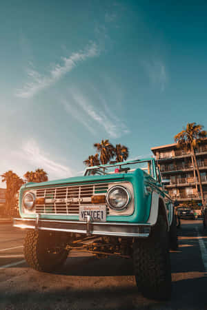 Vintage Beachside Bronco Sunset Wallpaper