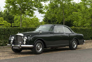 Vintage Bentley S2 Luxuriously Parked Wallpaper