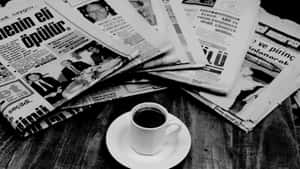 Vintage Black And White Newspaper On A Table Wallpaper