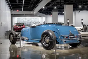 Vintage Blue Car Exhibit Petersen Automotive Museum Wallpaper
