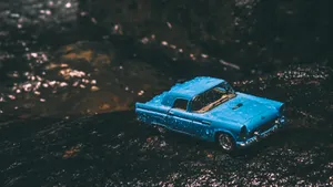 Vintage Blue Toy Car Wet Rocks Wallpaper