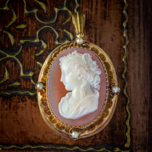 Vintage Cameo Pendanton Wooden Background Wallpaper