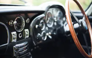 Vintage Car Interior Steering Wheeland Dashboard Wallpaper