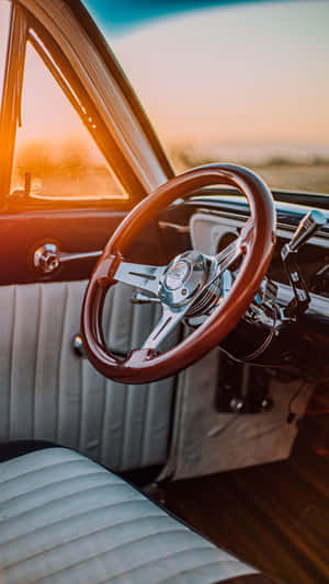 Vintage Car Interior Sunset Glow Wallpaper