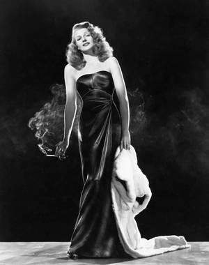 Vintage Charm - Rita Hayworth Seen In A Candid Moment Wallpaper