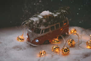 Vintage Christmas Vanwith Treeand Lights Wallpaper