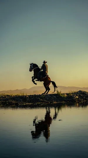 Vintage Cowboy On Horseback Wallpaper