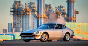 Vintage Datsun 240z Embracing Sunset Wallpaper