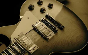 Vintage Electric Guitar Closeup Sepia Tone Wallpaper