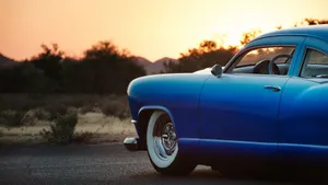 Vintage Family Sedan Exuding Classic Elegance Wallpaper